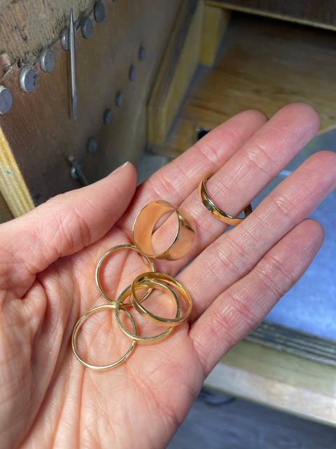 Multiple yellow gold bands.